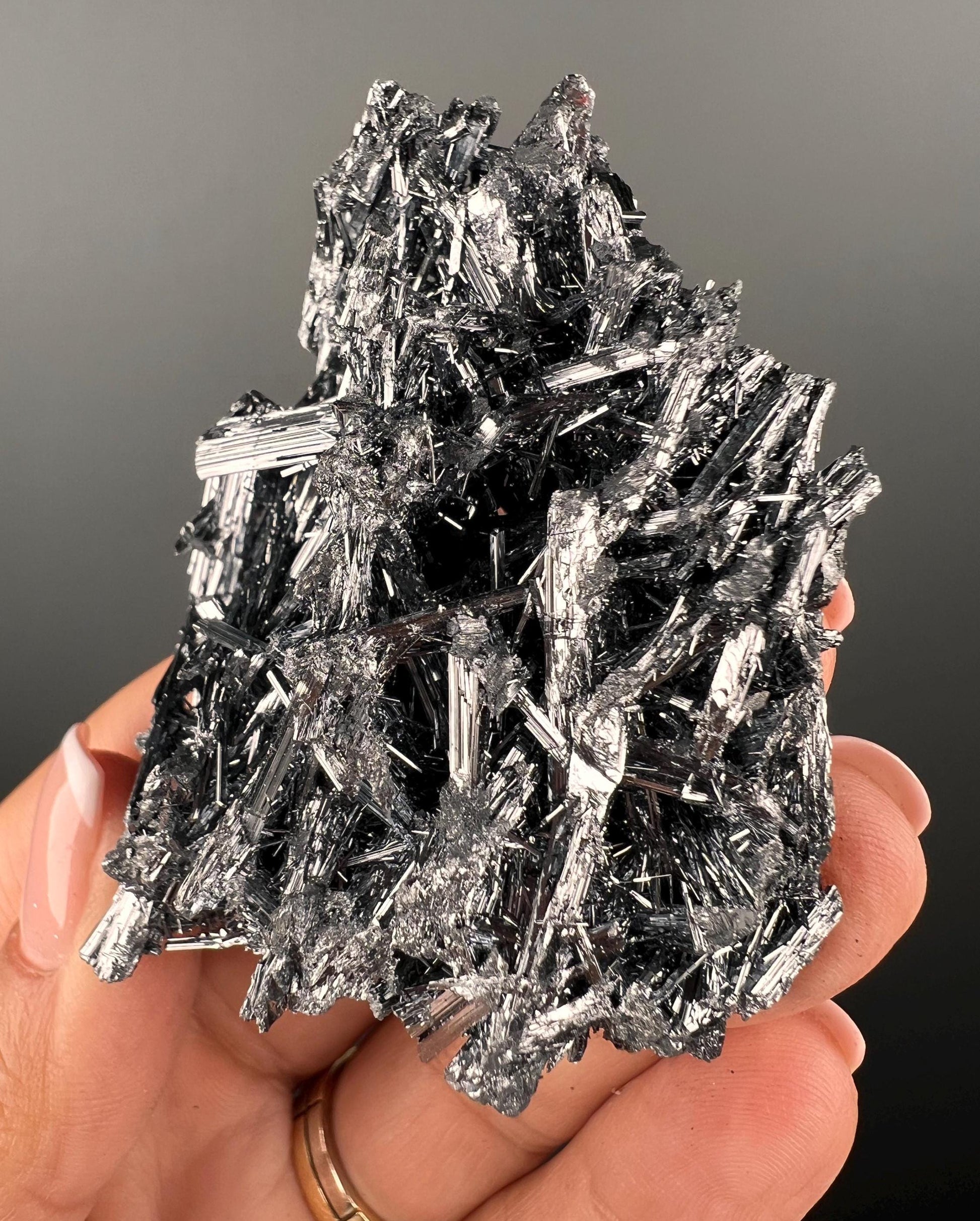 Silvery Stibnite Crystals with MirrorLike Luster