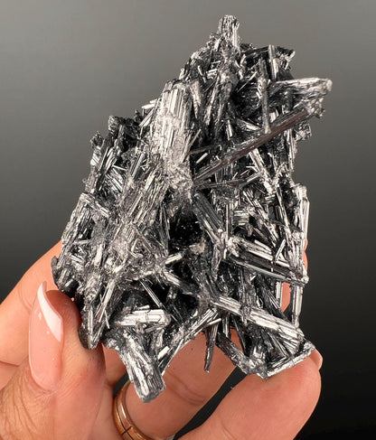 Silvery Stibnite Crystals with MirrorLike Luster