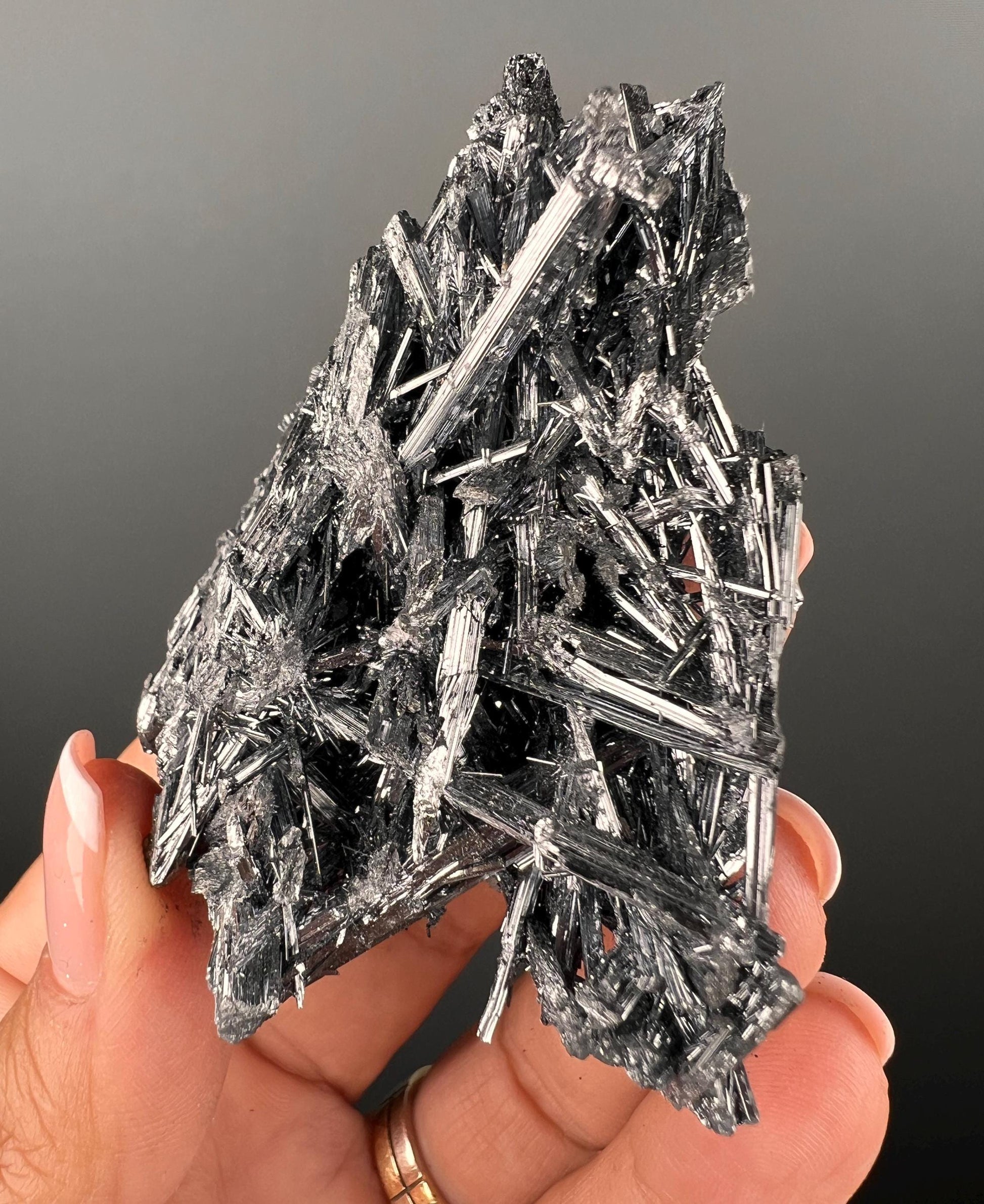 Silvery Stibnite Crystals with MirrorLike Luster