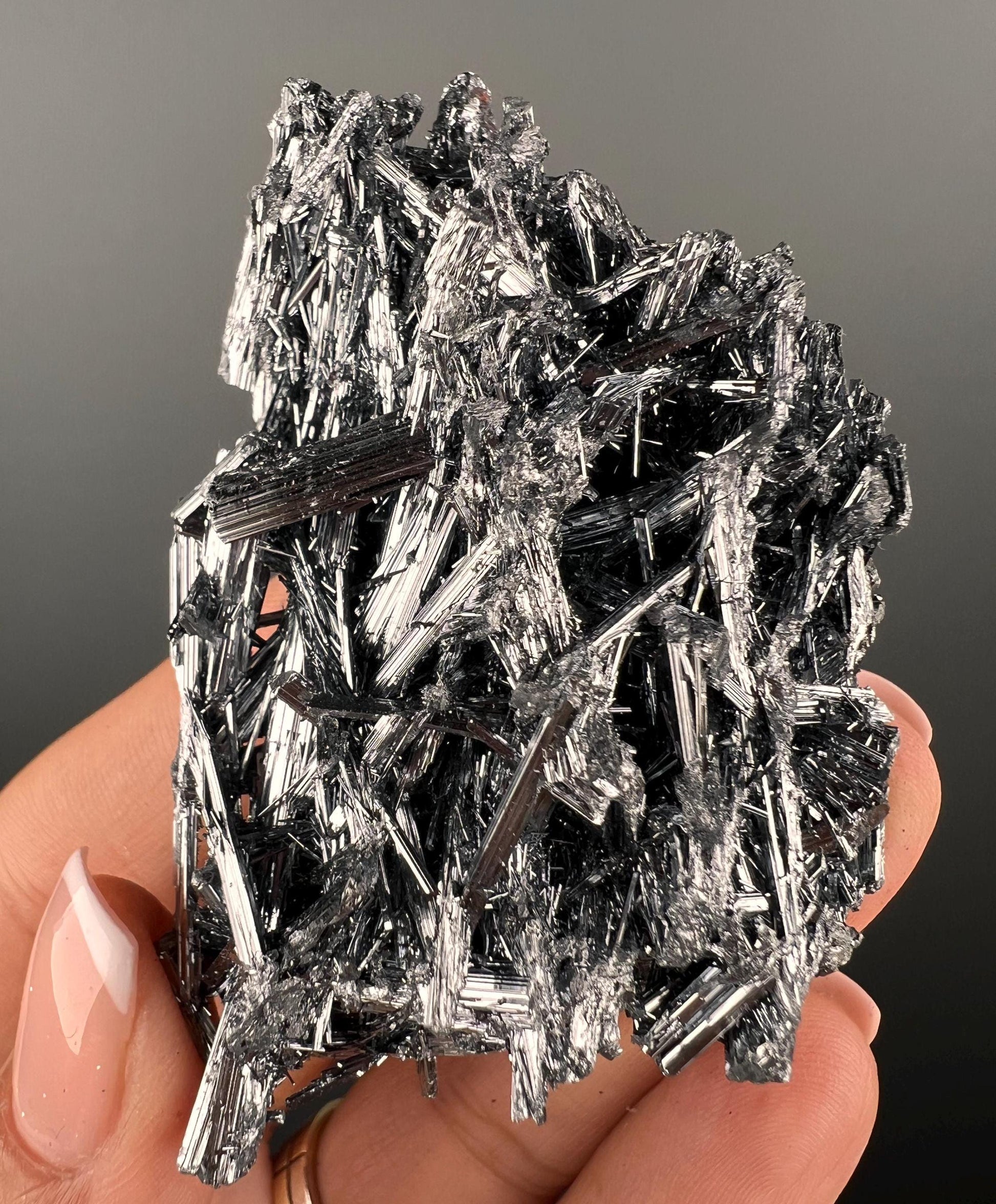 Silvery Stibnite Crystals with MirrorLike Luster