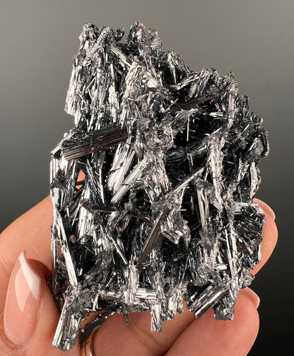 Silvery Stibnite Crystals with MirrorLike Luster