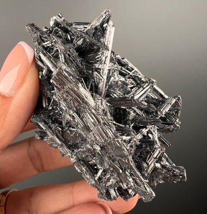 Silvery Stibnite Crystals with MirrorLike Luster