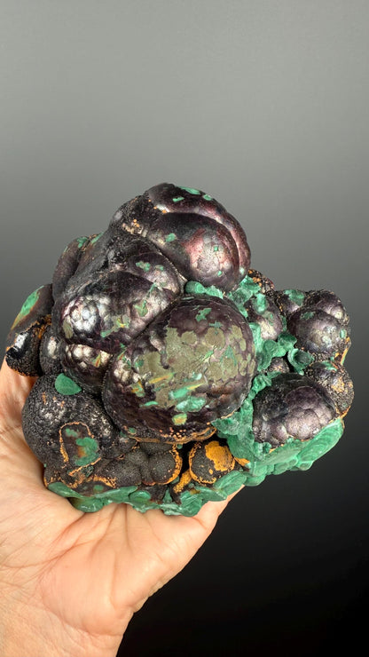 Spheroidal Clusters of Botryoidal Malachite Covered in Coppery Layer of Hematite