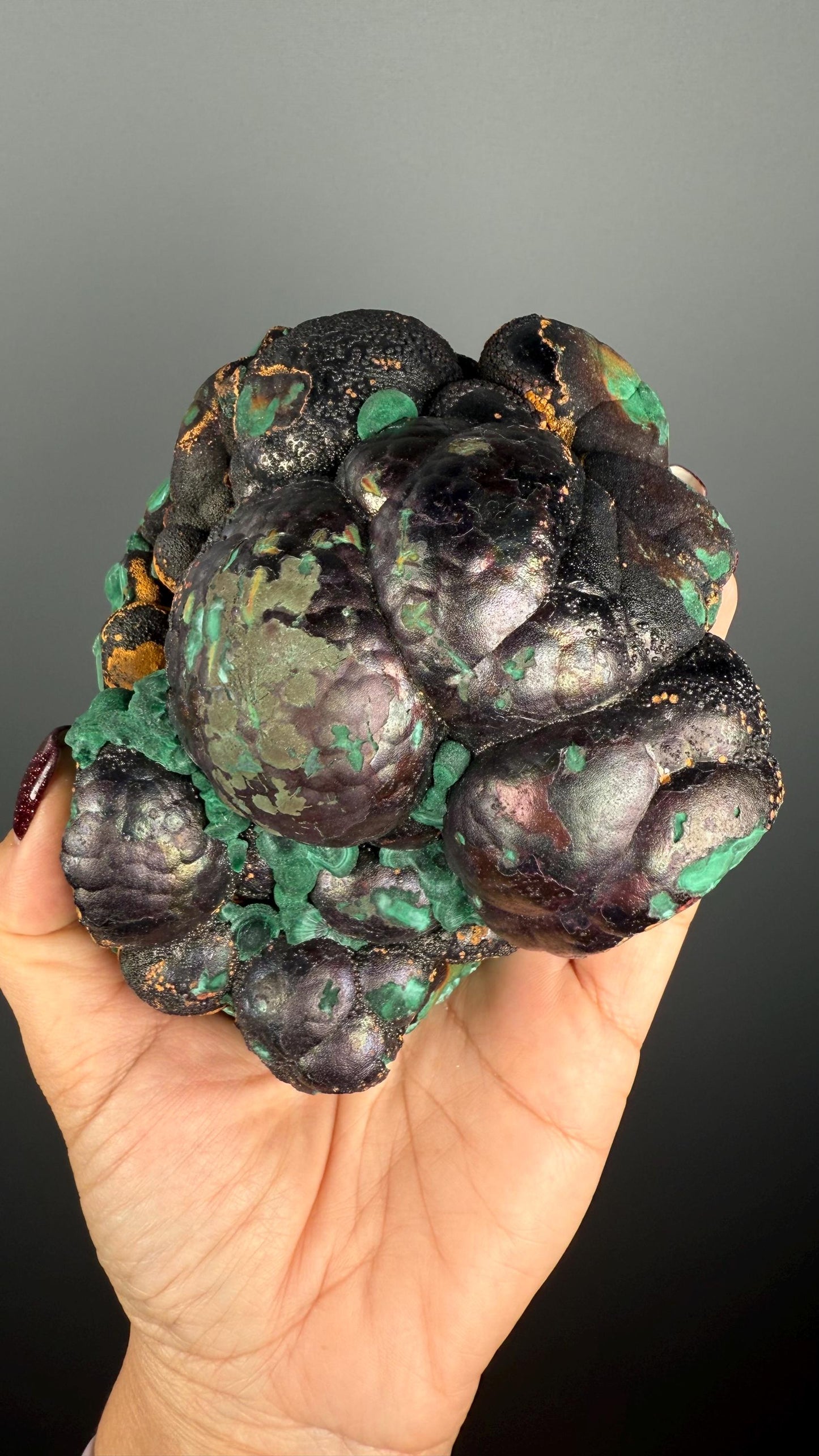 Spheroidal Clusters of Botryoidal Malachite Covered in Coppery Layer of Hematite