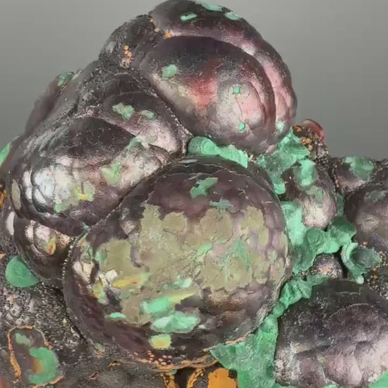 Spheroidal Clusters of Botryoidal Malachite Covered in Coppery Layer of Hematite