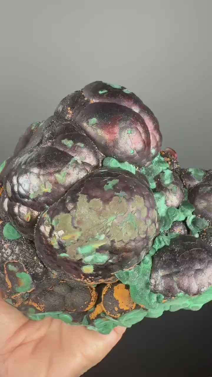 Spheroidal Clusters of Botryoidal Malachite Covered in Coppery Layer of Hematite